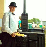 Brian Golding of the Franklin Historical Society bakes scones in a cast iron oven.