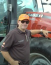 Phil Gill of Roger Gill Agriculture admiring a Case tractor.